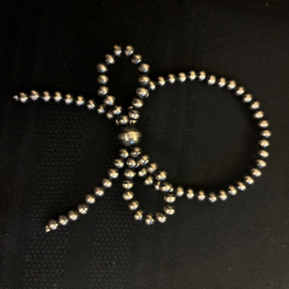 Sterling silver pearl bow bracelet. Stretchy